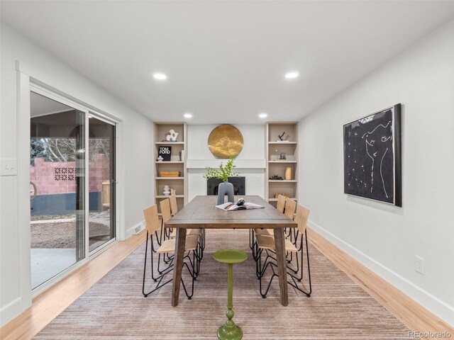 dining area featuring recessed lighting, light wood-type flooring, baseboards, and visible vents