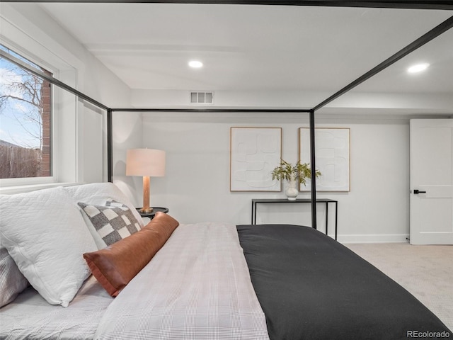 bedroom featuring visible vents, recessed lighting, baseboards, and carpet