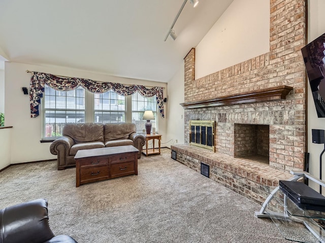 15035 E Grand Ave, Aurora, CO 80015 - living area featuring carpet floors, a fireplace, track lighting, and high vaulted ceiling