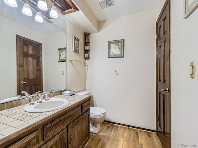15035 E Grand Ave, Aurora, CO 80015 - half bath featuring vanity and wood finished floors