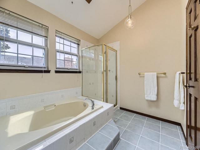 15035 E Grand Ave, Aurora, CO 80015 - bathroom with vaulted ceiling, a bath, a stall shower, and tile patterned flooring