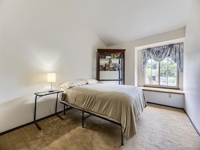 15035 E Grand Ave, Aurora, CO 80015 - carpeted bedroom featuring vaulted ceiling and baseboards