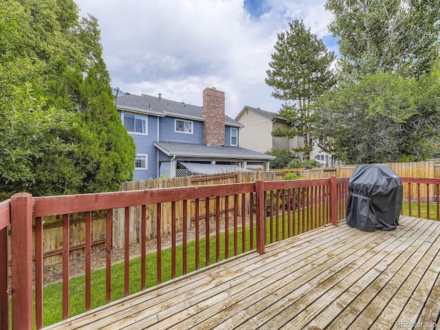 15035 E Grand Ave, Aurora, CO 80015 - deck with area for grilling, a fenced backyard, and a residential view