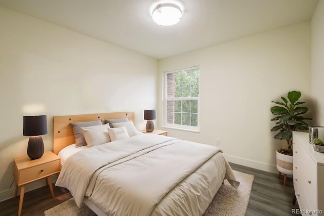 bedroom featuring dark wood-type flooring