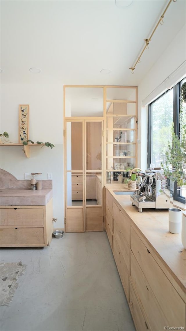 bathroom with concrete flooring and vanity