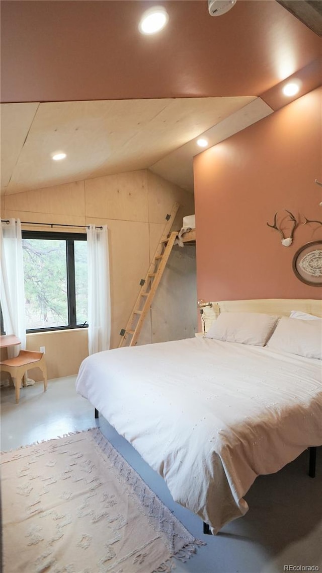 bedroom with recessed lighting, finished concrete flooring, and lofted ceiling