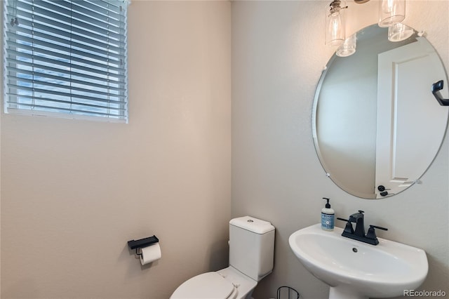 bathroom featuring a sink and toilet