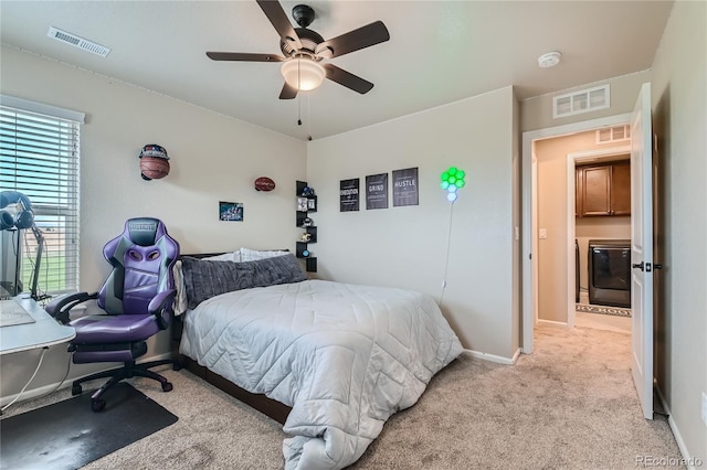 bedroom featuring visible vents, light colored carpet, and baseboards