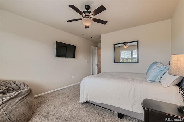 carpeted bedroom featuring a ceiling fan and baseboards