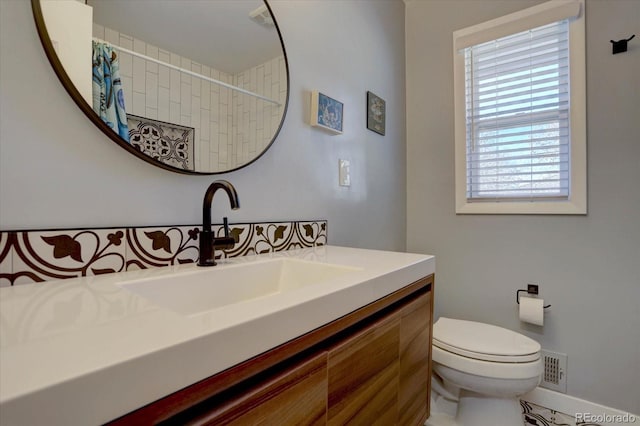 full bathroom with vanity, curtained shower, and toilet