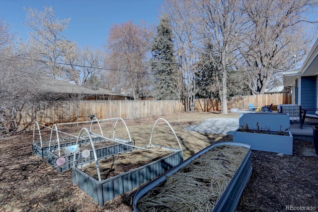 view of yard featuring a garden and fence