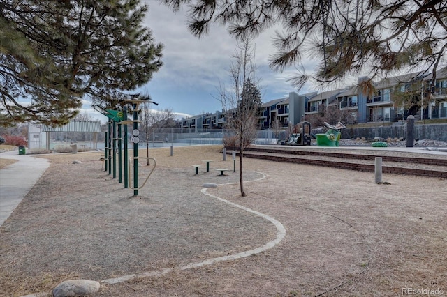 view of property's community featuring playground community and a residential view