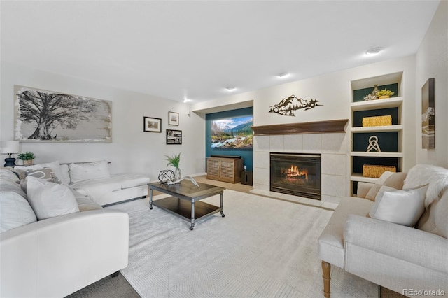 carpeted living room with built in features and a fireplace