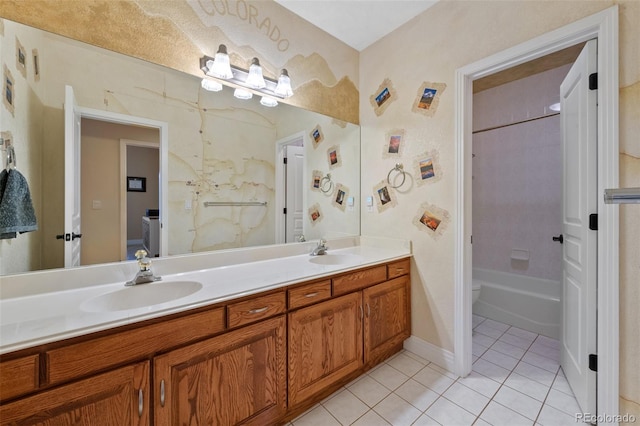 bathroom featuring tile patterned flooring, a sink, toilet, and double vanity