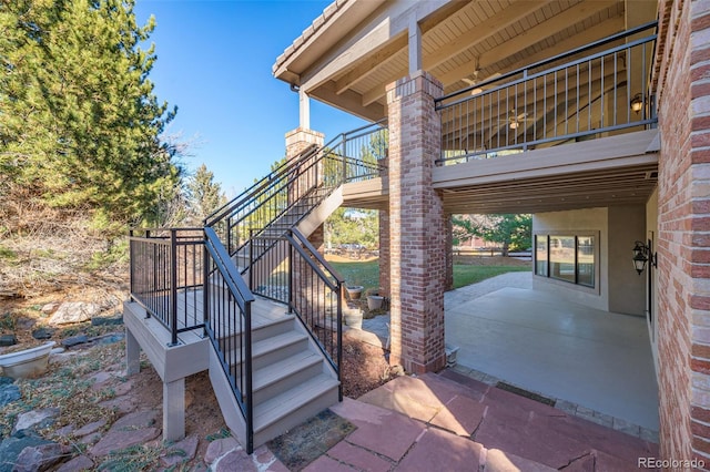 exterior space with a tile roof and a patio