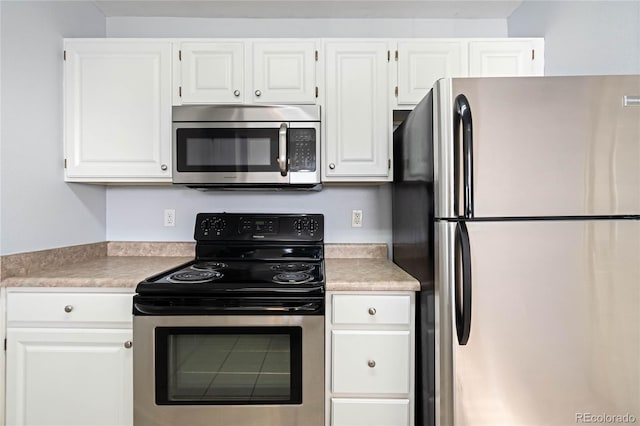 kitchen with white cabinetry and appliances with stainless steel finishes