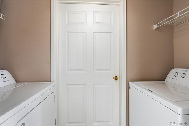 laundry room with independent washer and dryer