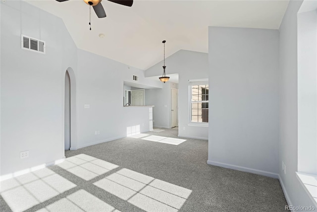 unfurnished living room featuring ceiling fan, light carpet, and high vaulted ceiling