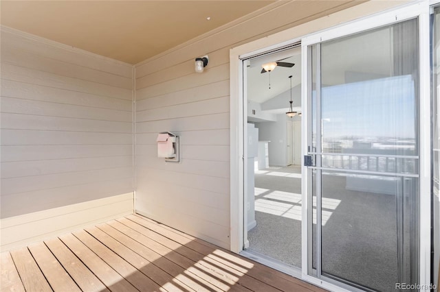 bathroom featuring wood-type flooring, lofted ceiling, and wooden walls