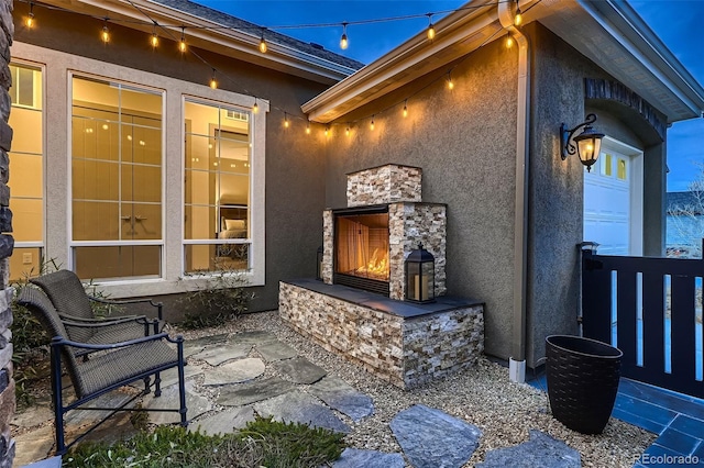 view of patio / terrace with an outdoor stone fireplace