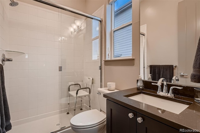 full bath with a shower stall, toilet, and vanity