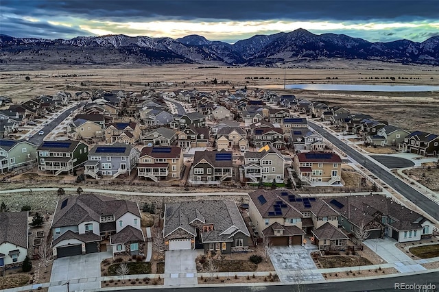 birds eye view of property with a residential view and a mountain view