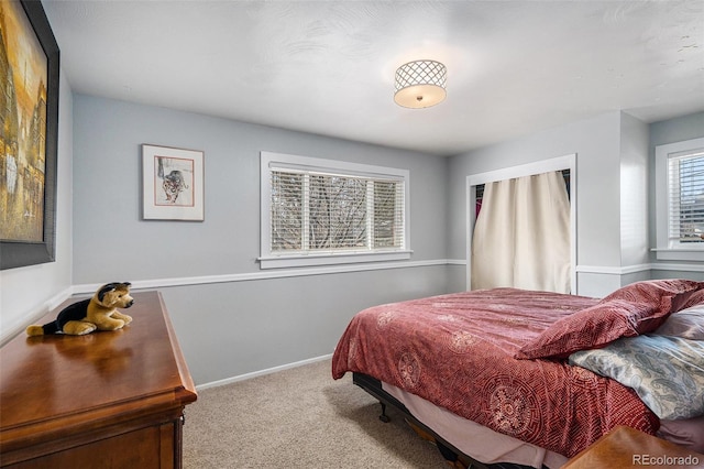 bedroom with baseboards and carpet floors