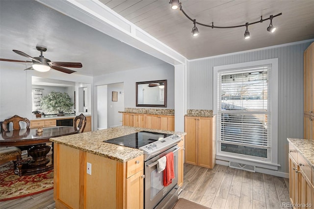 kitchen featuring light stone countertops, visible vents, electric range, light wood-style flooring, and ceiling fan