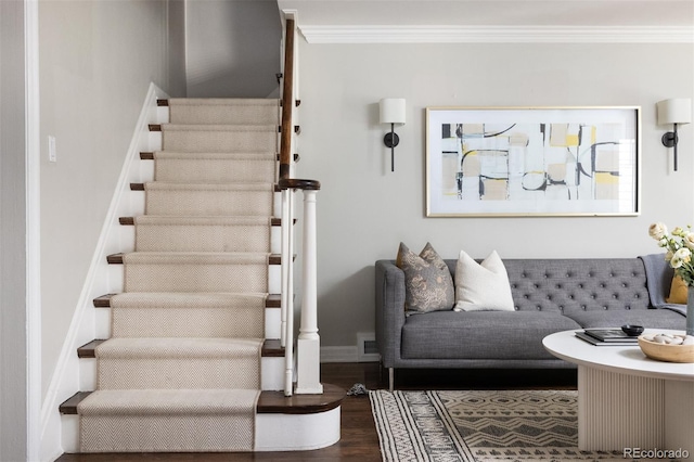 living room with crown molding and dark wood-type flooring