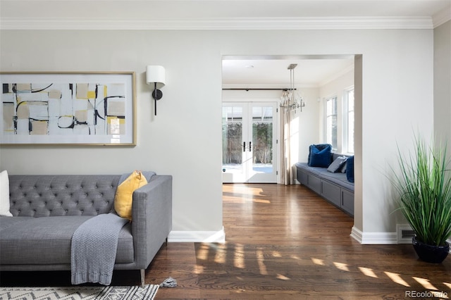 hall featuring dark wood-type flooring, crown molding, and french doors