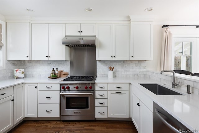 kitchen featuring sink, white cabinets, appliances with stainless steel finishes, and tasteful backsplash