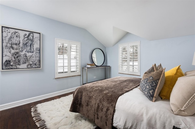 bedroom featuring wood-type flooring and lofted ceiling