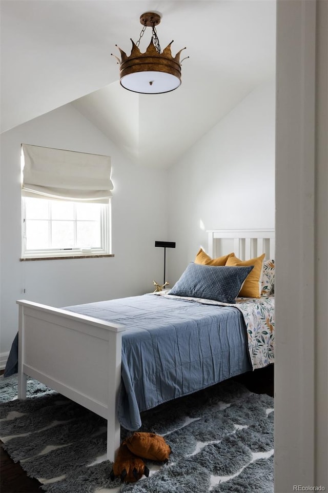 bedroom featuring lofted ceiling