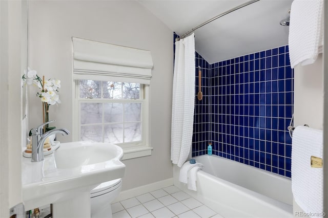 bathroom with toilet, shower / bath combination with curtain, tile patterned floors, and lofted ceiling