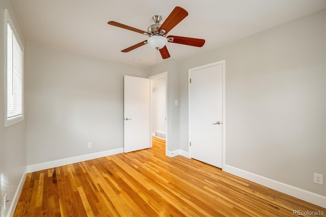 unfurnished bedroom featuring light wood-type flooring and ceiling fan