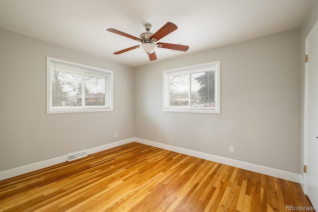 empty room featuring ceiling fan and light wood-type flooring