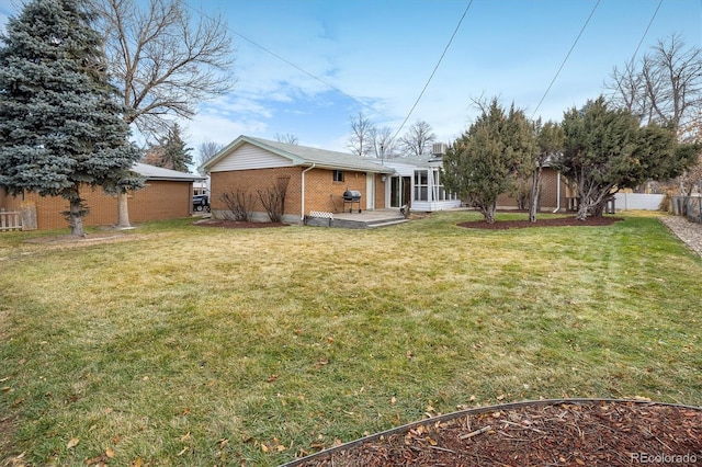 view of yard with a sunroom