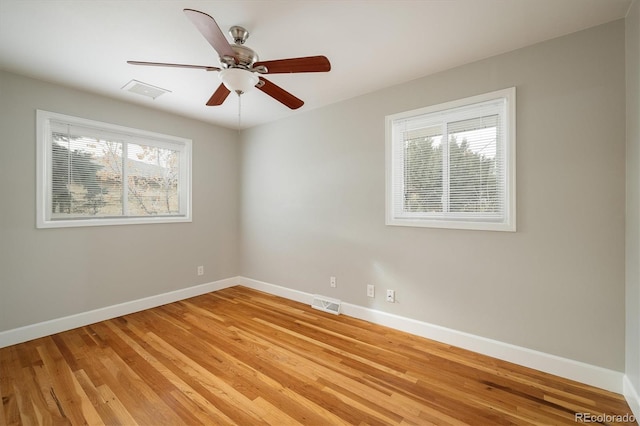 empty room featuring ceiling fan and light wood-type flooring