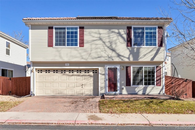 view of front of property with a garage