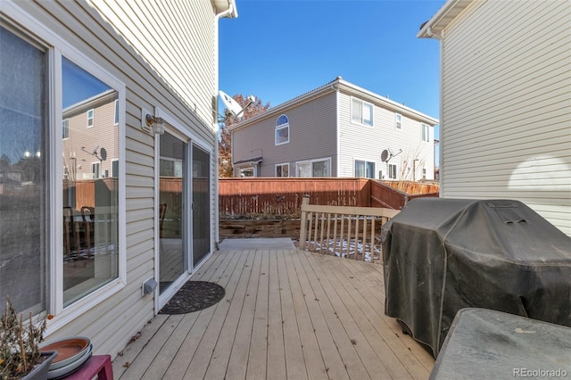 wooden deck featuring area for grilling