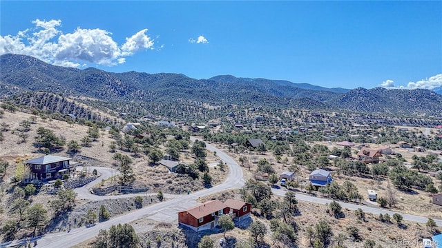 birds eye view of property featuring a mountain view