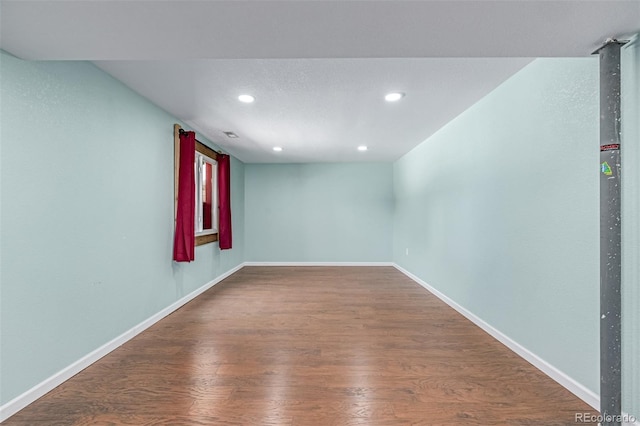 903 Cameron Dr, Severance, CO 80550 - spare room with recessed lighting and wood finished floors
