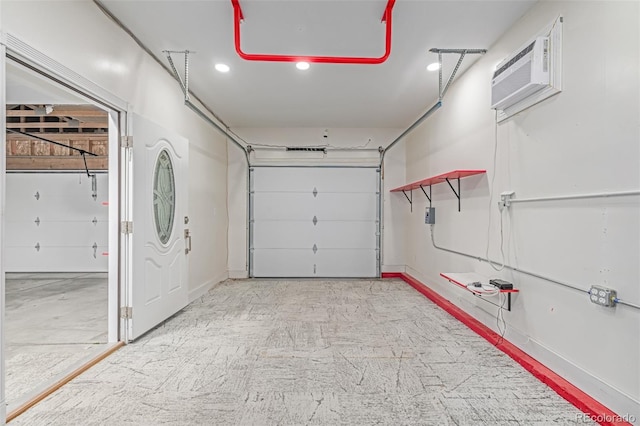 903 Cameron Dr, Severance, CO 80550 - garage featuring a wall mounted AC and recessed lighting
