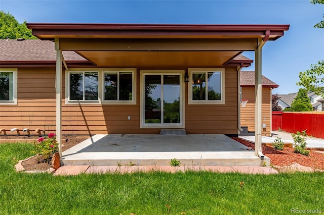 903 Cameron Dr, Severance, CO 80550 - back of house with a patio area and roof with shingles