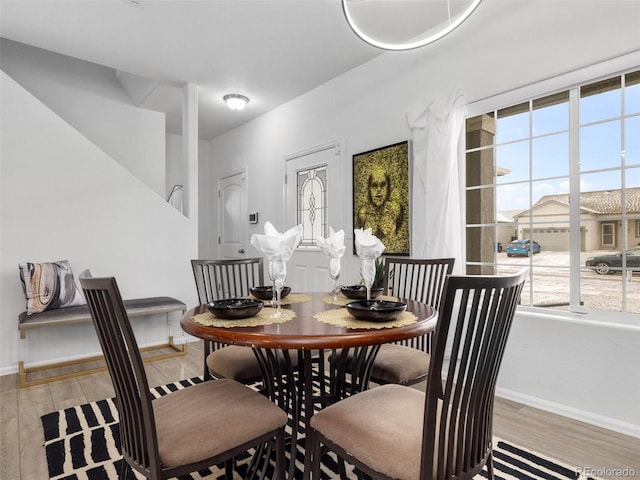 dining space featuring light wood-type flooring