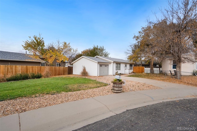 view of front of house with a garage and a front yard