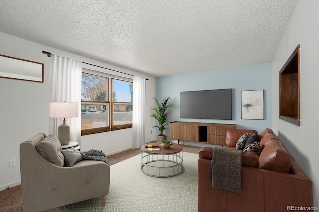 living room with carpet flooring and a textured ceiling