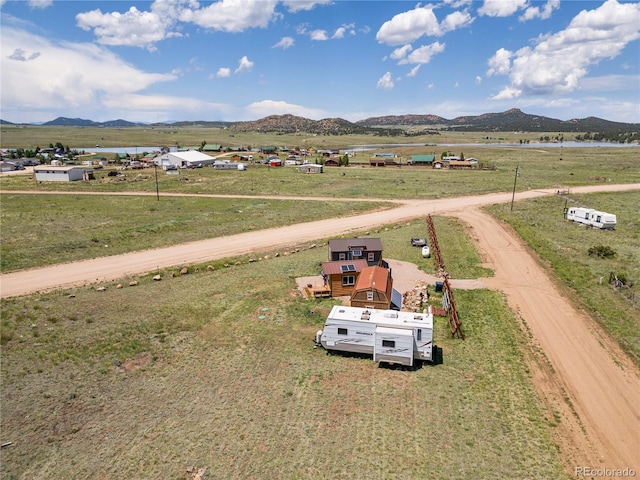 drone / aerial view with a mountain view and a rural view