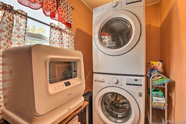 laundry room with stacked washer and clothes dryer