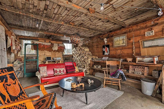 living room with wood walls, wooden ceiling, and concrete floors